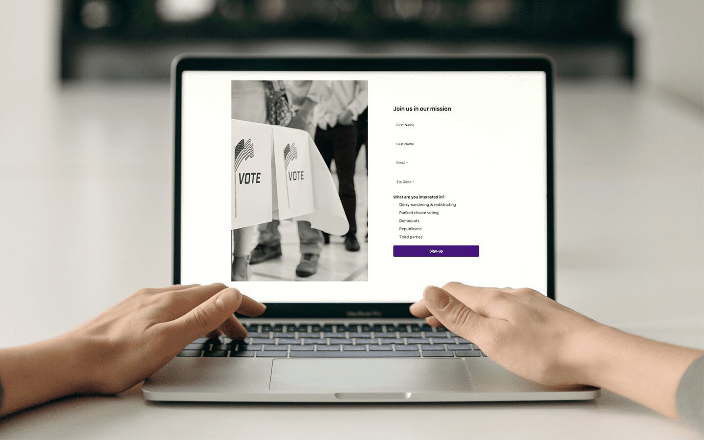 Photo of someone using their laptop to sign up for the FairVote newsletter
