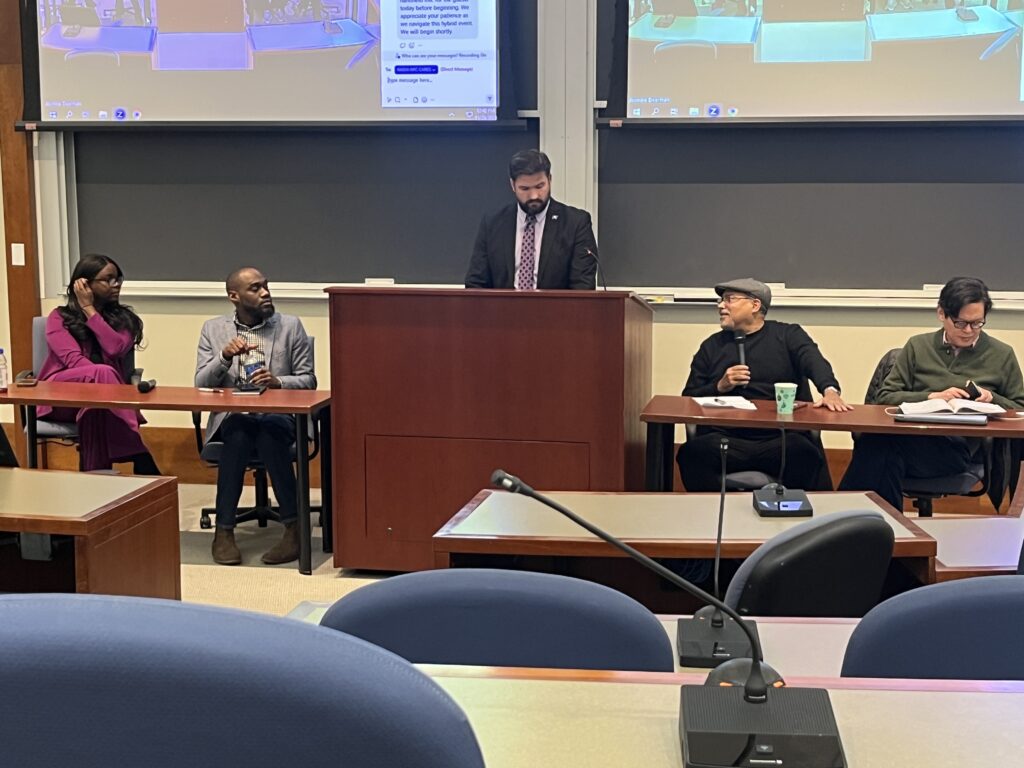 Photo of panelists at a table at an event at Columbia University