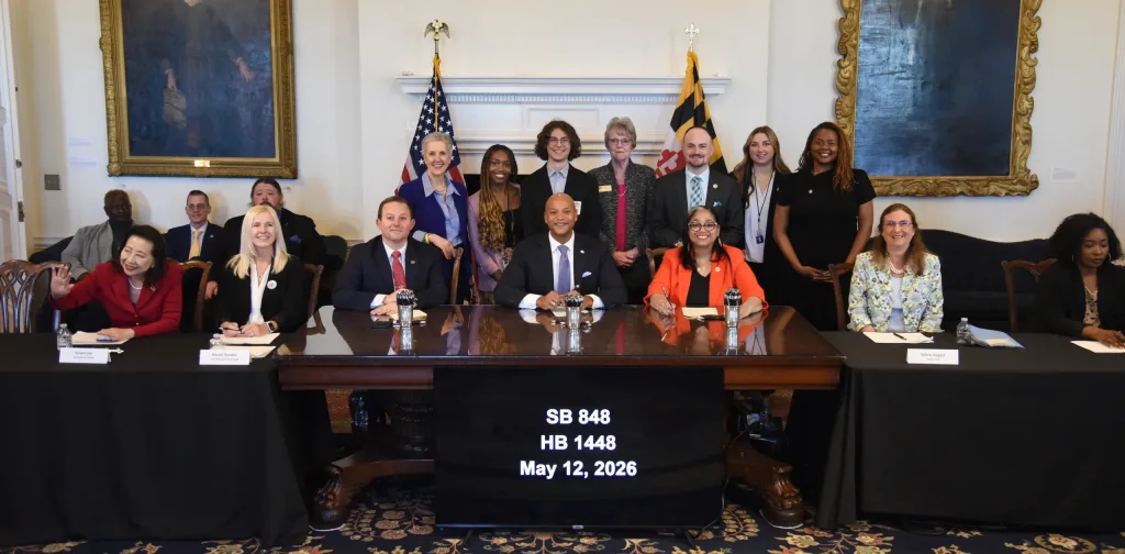Photo of Maryland Governor Wes Moore signing SB848 / HB1448