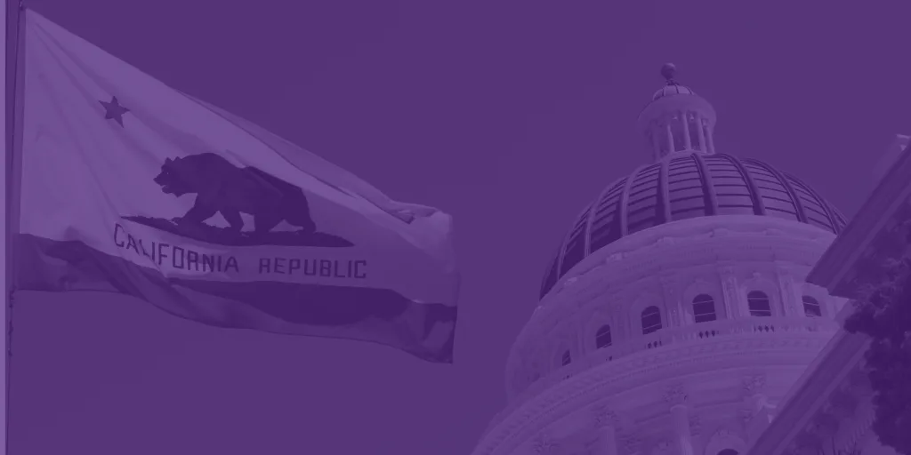 Photo of the California flag flying in front of the state capitol building in Sacramento